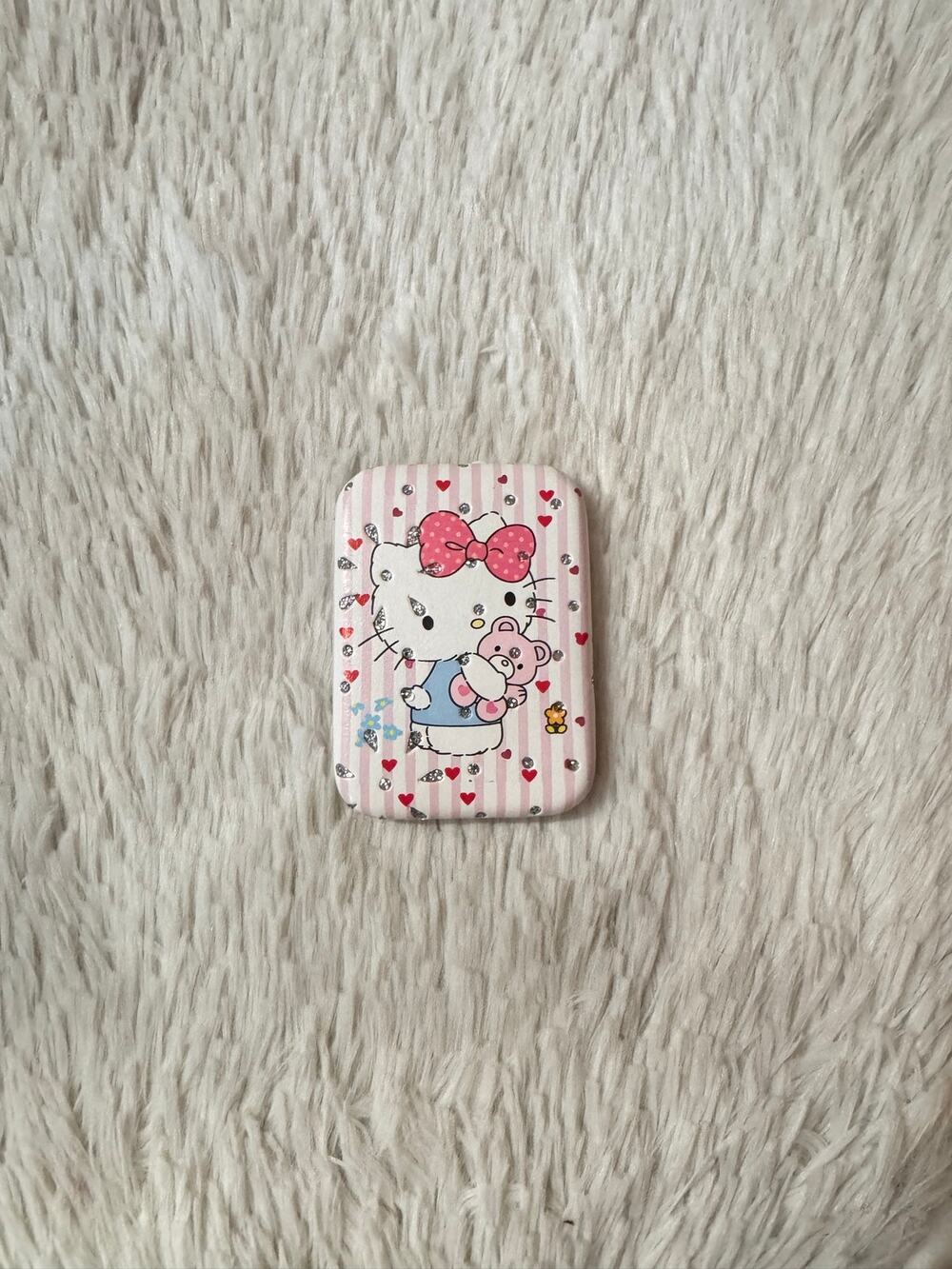 Hello Kitty pink & white striped compact mirror holding a teddy bear sparkly